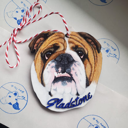 Decorative pet portrait ornament with a dog's face and name 